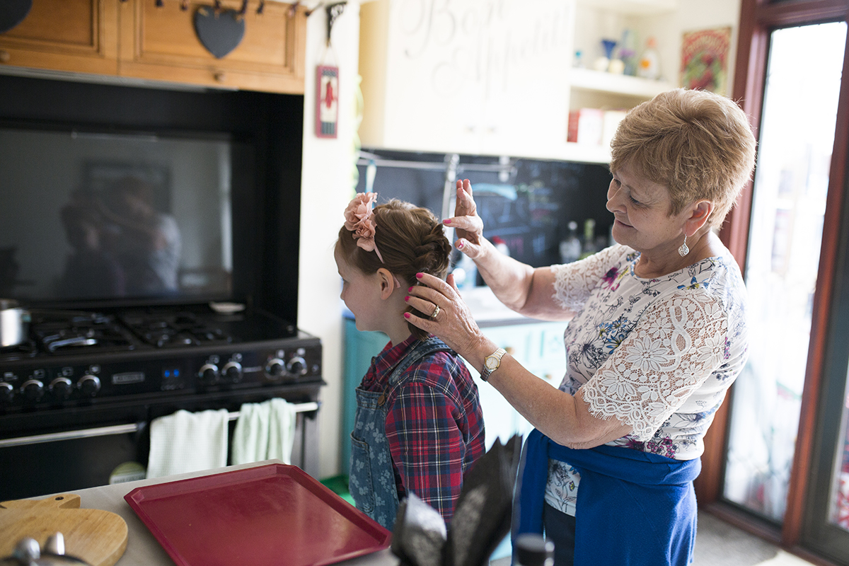 grandmother doing granddaughters wedding hair