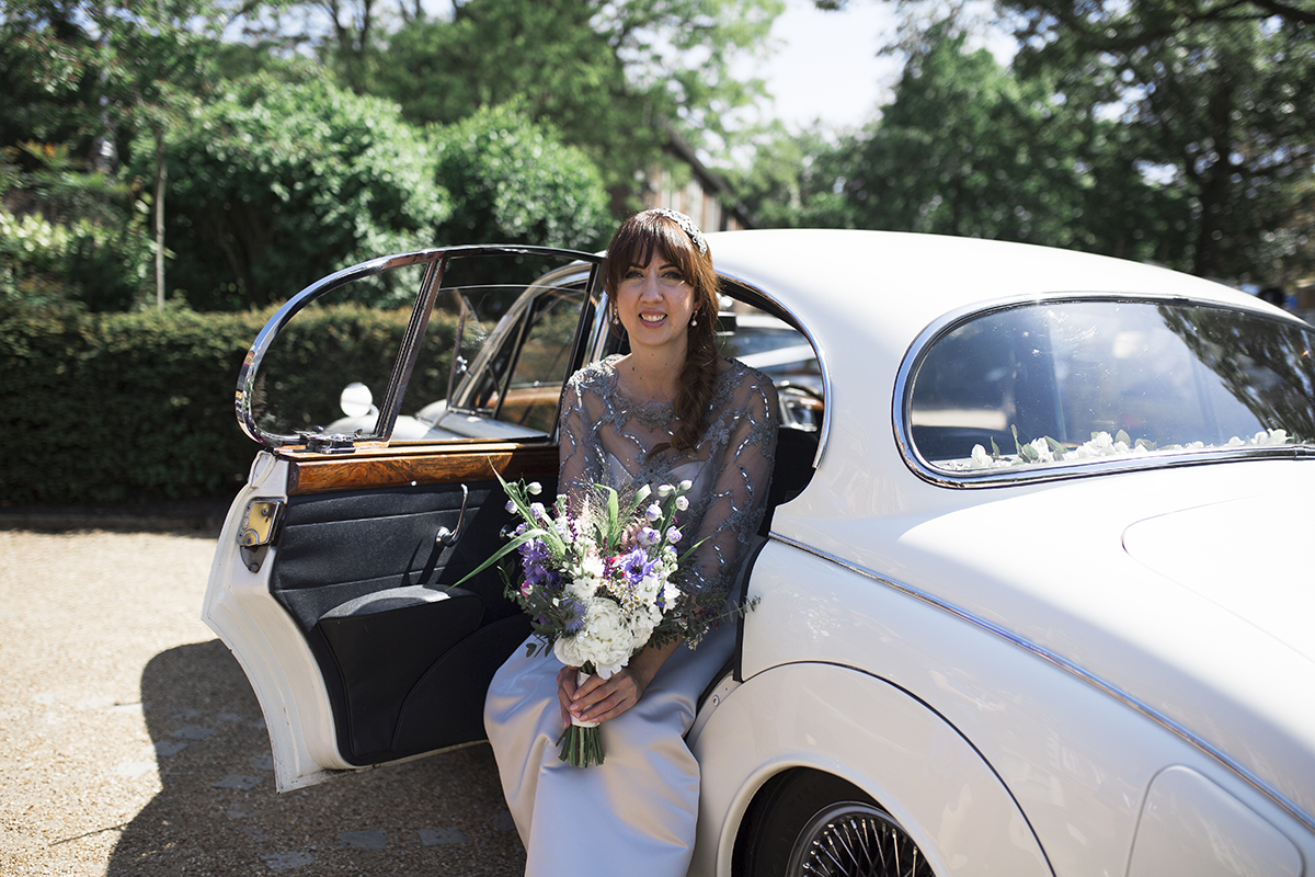 Bride in wedding car Sophie Lake Photography