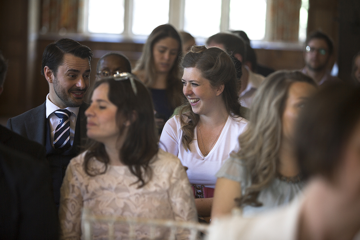 Wedding guests laughing Sophie Lake Photography