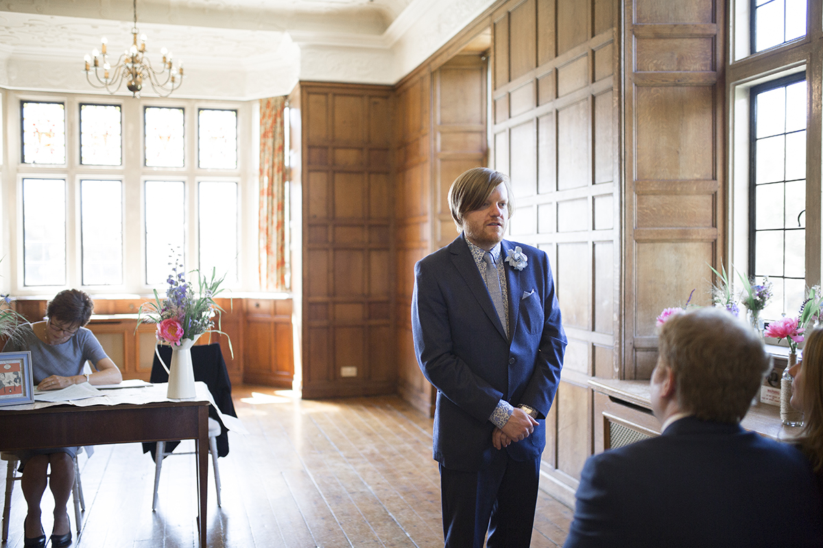 Groom waiting at alter Sophie Lake Photography