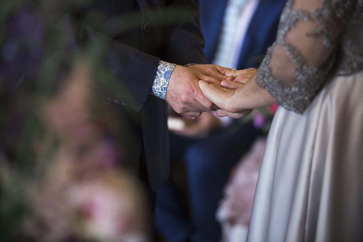 Bride and Groom holding hands Sophie Lake Photography