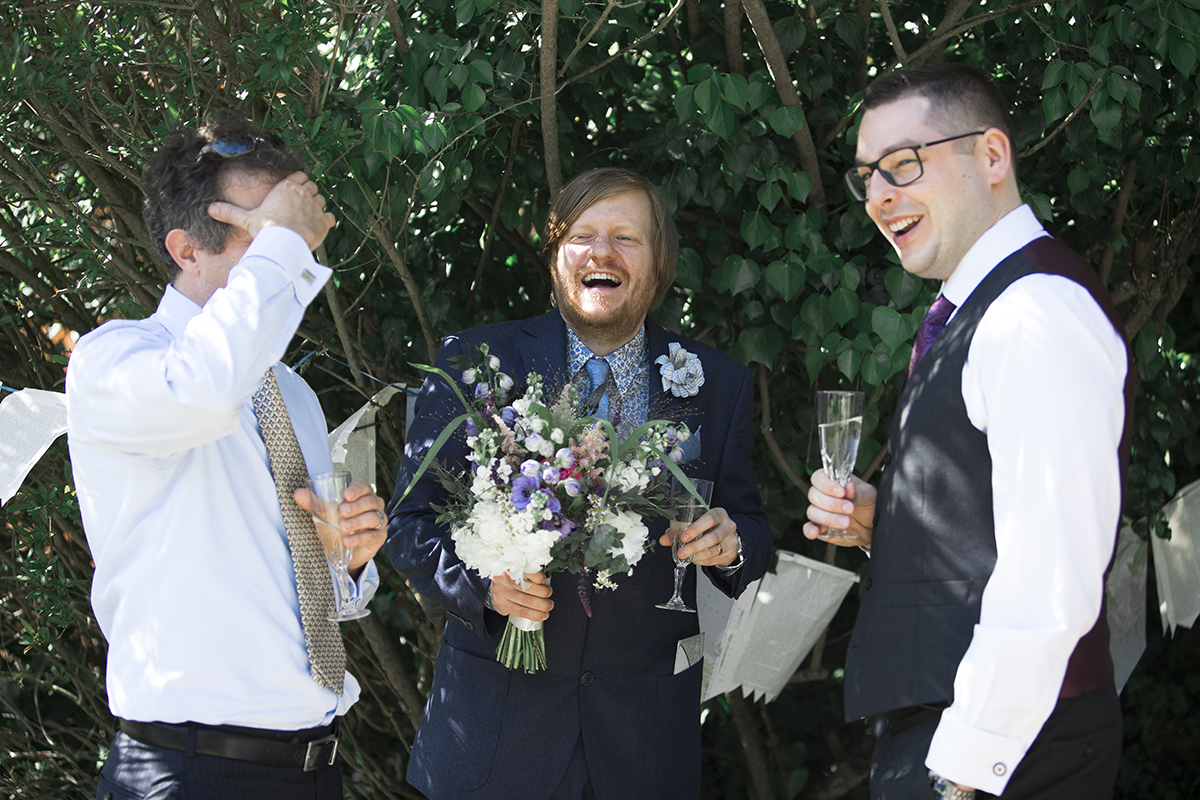 Groomsmen laughing Sophie Lake Photography