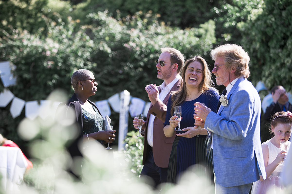 Wedding guests laughing Sophie Lake Photography