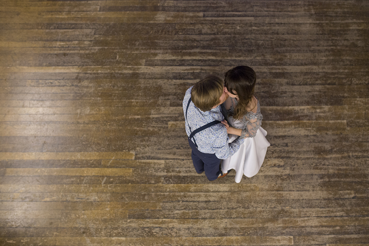 bride and groom kissing on dance floor