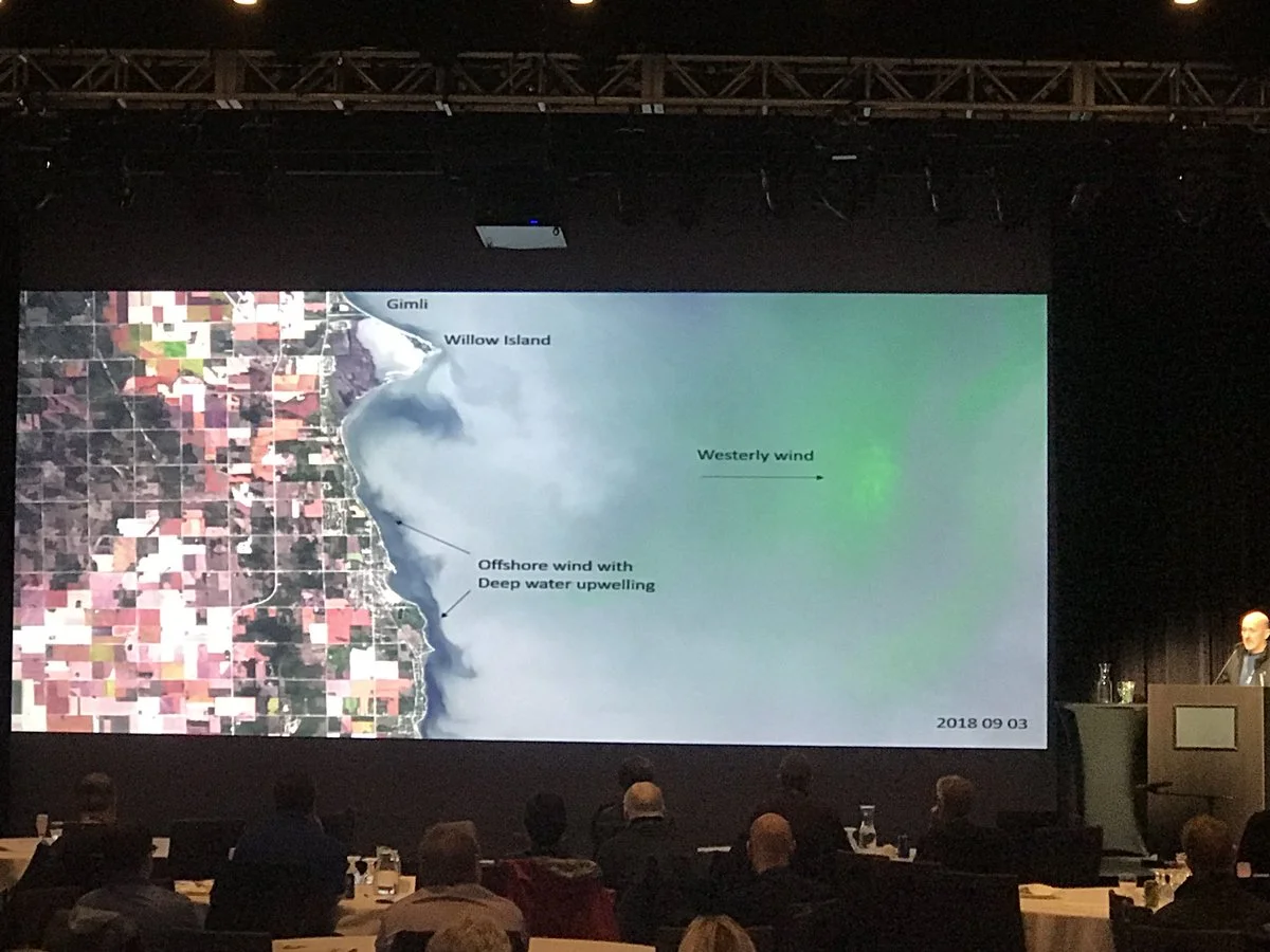 NextGen’s invited presentation on BloomFinder, Manitoba GIS Users Group Conference, October 17, 2018. This slide shows upwelling of clear (radiometrically dark pixels) bottom water during the bloom season. Images like this can help you plan for a great day on the beach.