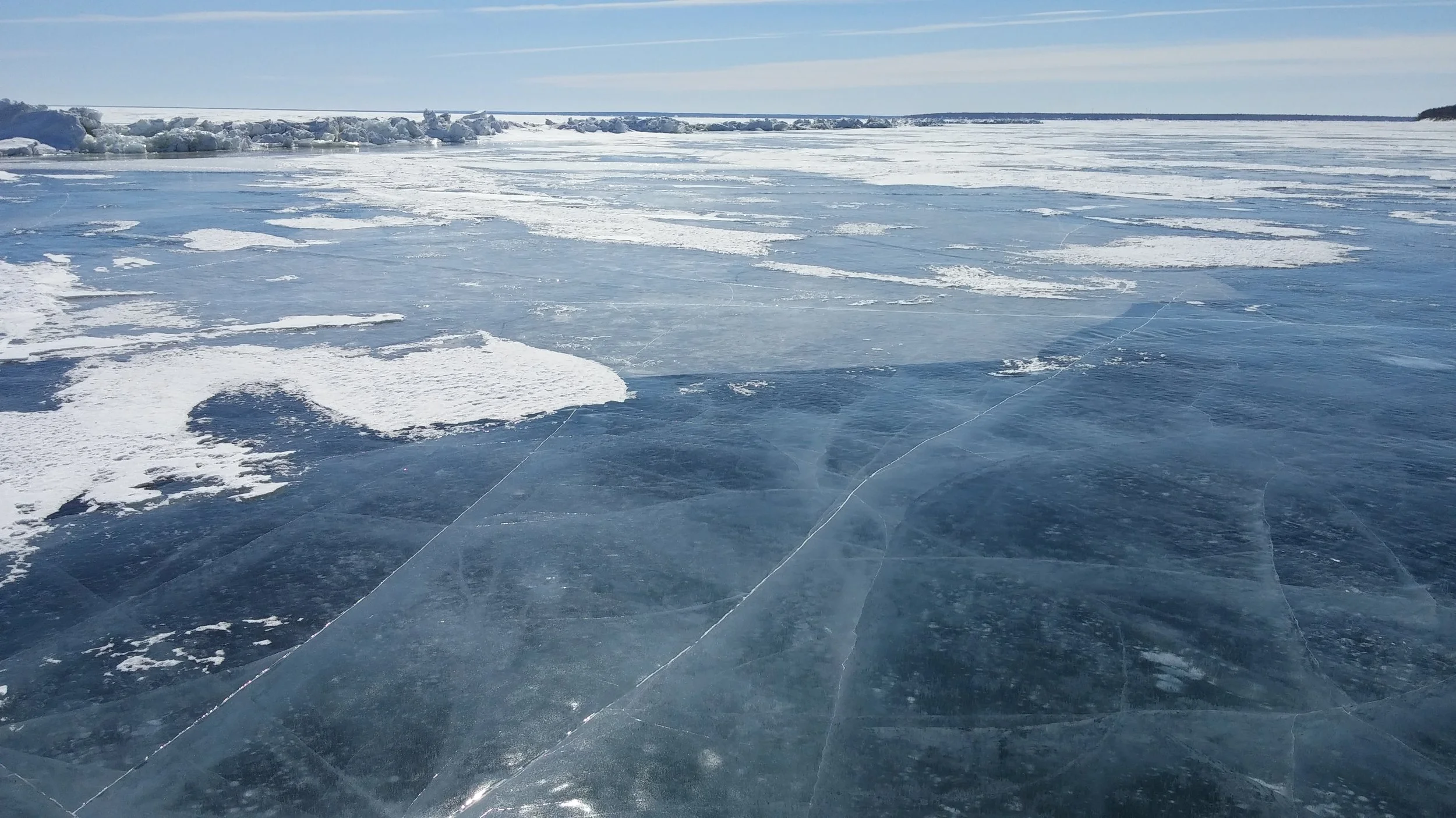 The pressure ridge in the distance will start to collapse and expose open water long before the competency of the horizontal ice is compromised. A map of ridges derived from satellite aids winter navigation and helps avoid immersion in the ridge axis in the spring.