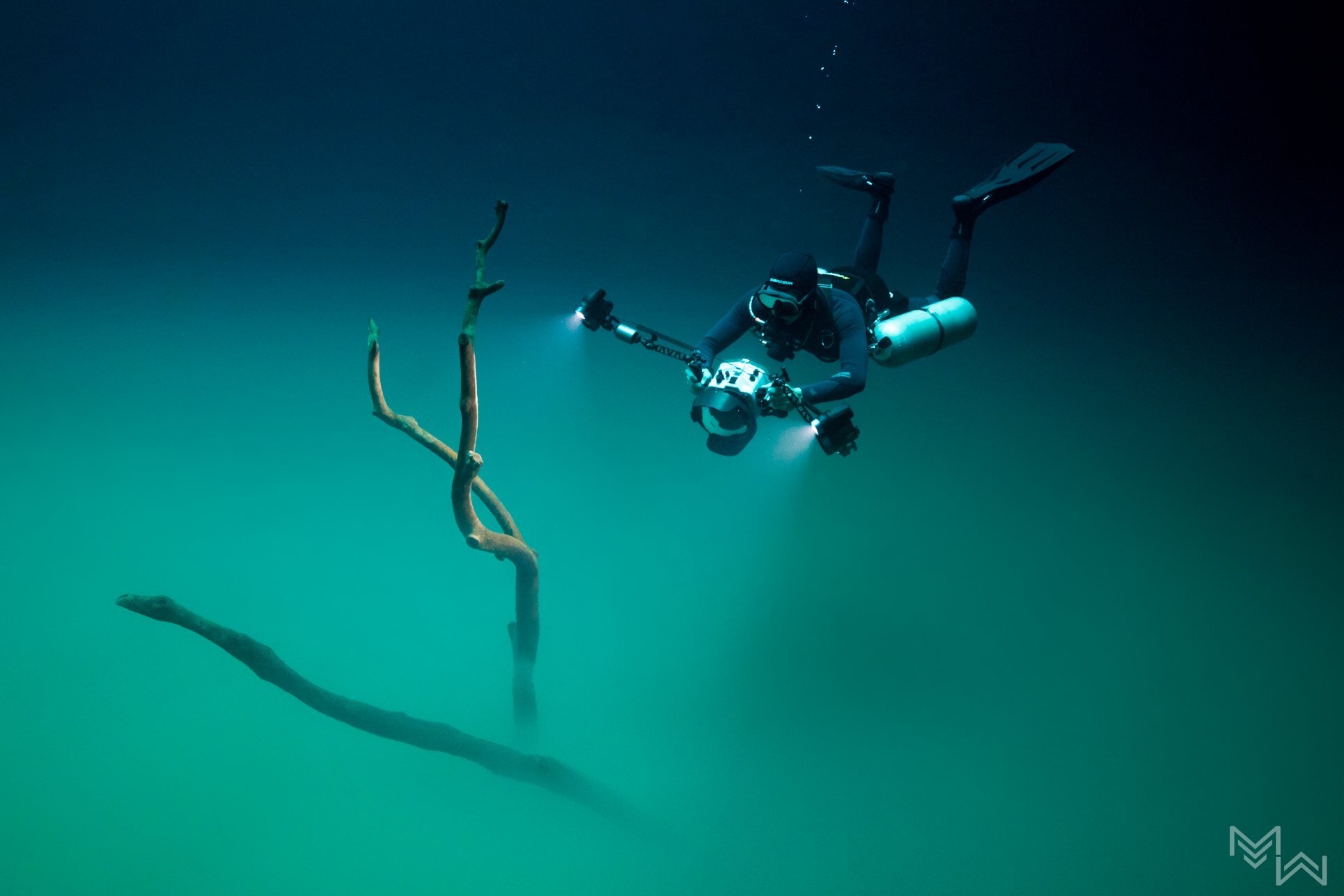 Cenote Angelita with DSLR camera strobes on side mount diver