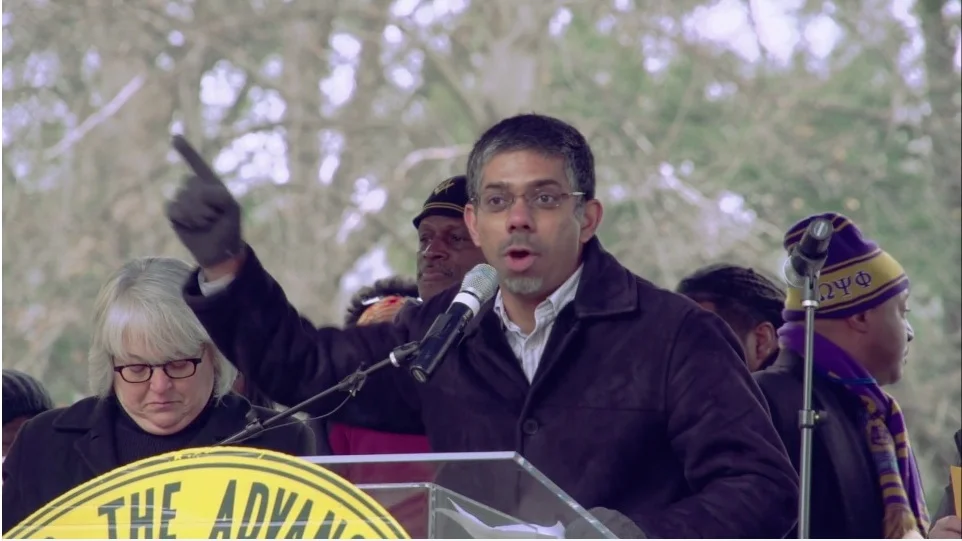 Manzoor Cheema speaking at the Moral Monday rally in Raleigh, North Carolina in 2014. Moral Mondays feature nonviolent civil disobedience led by religious progressives, and kicked off in 2013 in North Carolina. Image via Prashanth Kamalakanthan .