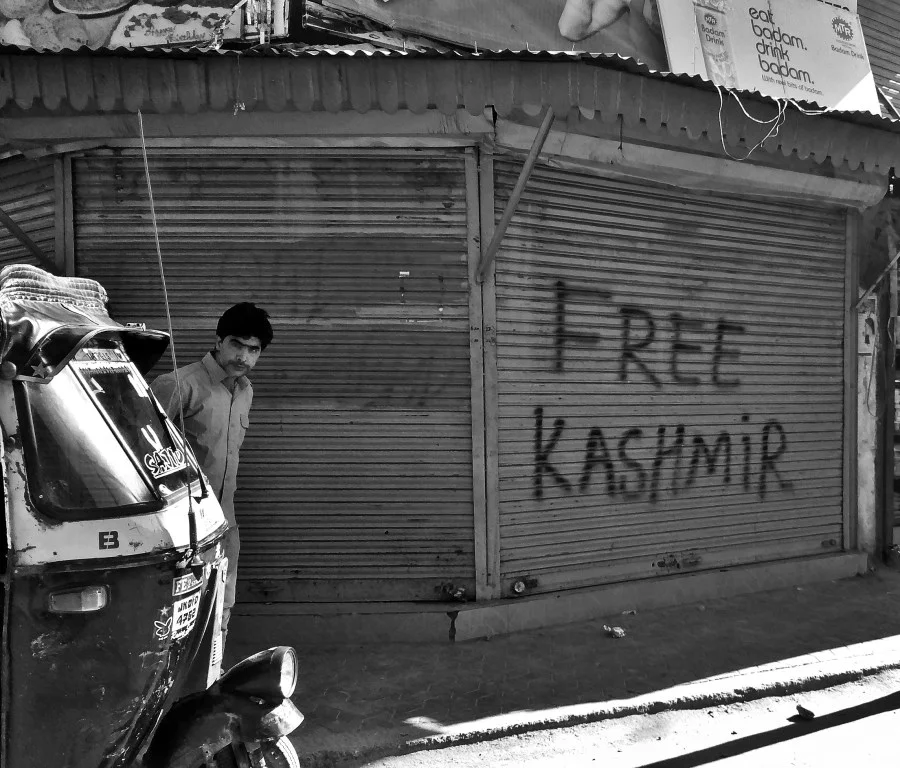 ‘Free Kashmir” graffiti on the door of a shop, a common sight in Jammu and Kashmir. Image: News Click