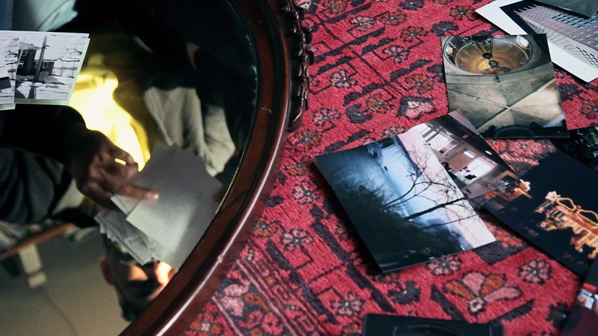 A still from Abu: Arshad looks through photographs of different moments in his life. Source: Film Trailer, IMDb