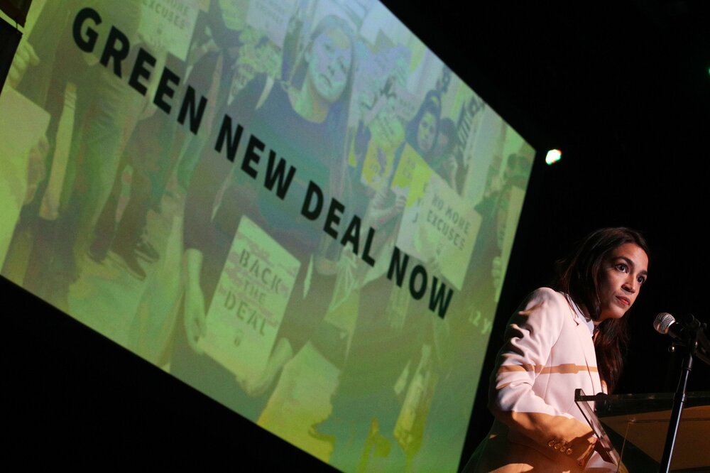 U.S. Representative for New York's congressional district, Alexandria Ocasio-Cortez speaks during a rally at Howard University May 13, 2019 in Washington, D.C. She has been one of the leading advocates for the GND. Image: Alex Wong via Jacobin