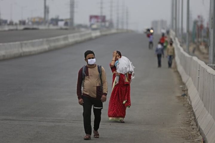 A couple along with their baby walks hundreds of miles hoping to reach their home as New Delhi goes on lockdown. Tens of thousands of daily-wage migrant workers found themselves without jobs and unable to find transportation home when India announced a lockdown on 24 March. Image:    Huffpost