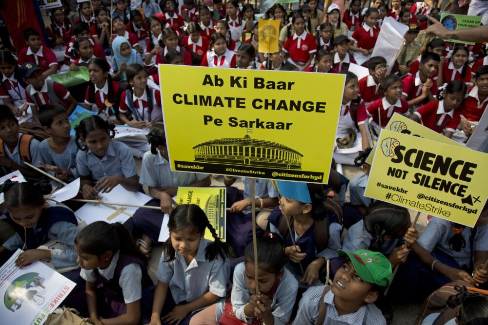 Indian students in Hyderabad participate in the March 2019 Climate Protest, holding placards that say “Ab ki baar Climate Change pe Sarkar” (This parliamentary election we shall vote based on climate change policies). Image:    AP Photo/Mahesh Kumar A.