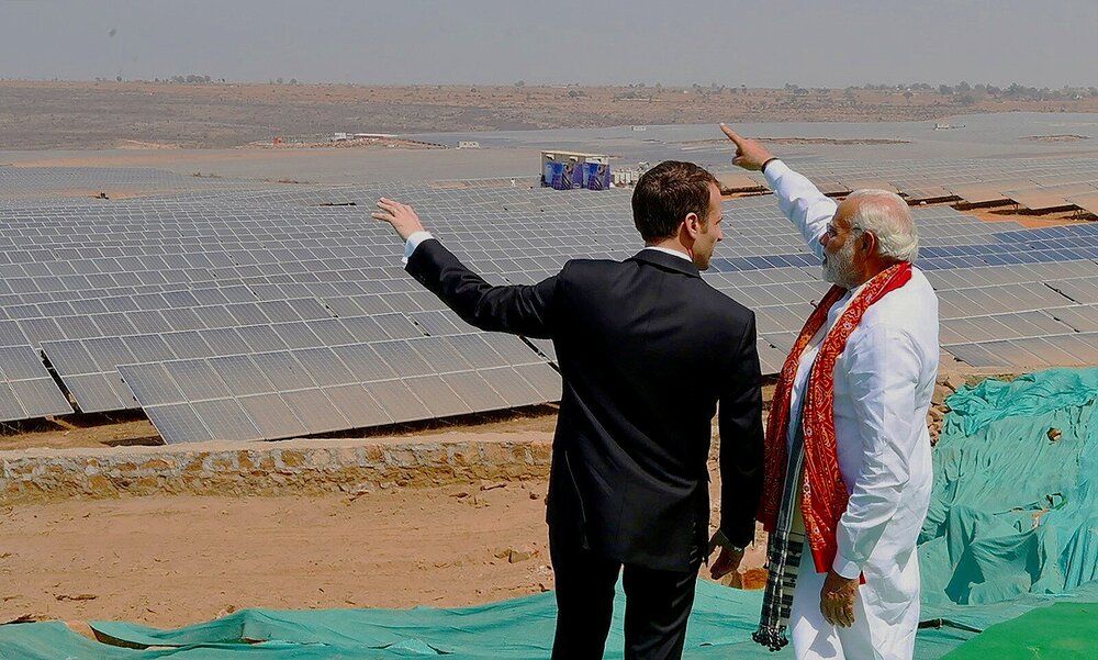 Indian Prime Minister Narendra Modi, hosts French President Emmanuel Macron at the opening of a new solar power “park” in Mirzapur village in Uttar Pradesh, Image: Ludovic Marin/AFP via Inside Climate News
