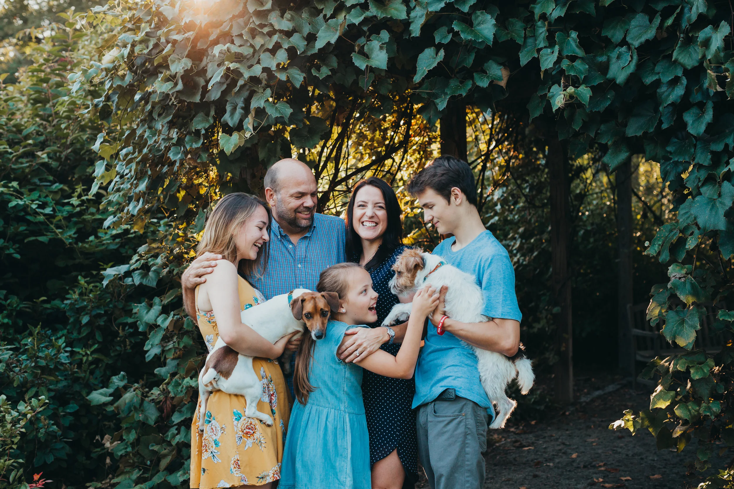 Family of five with two dogs at Acton Arboretum