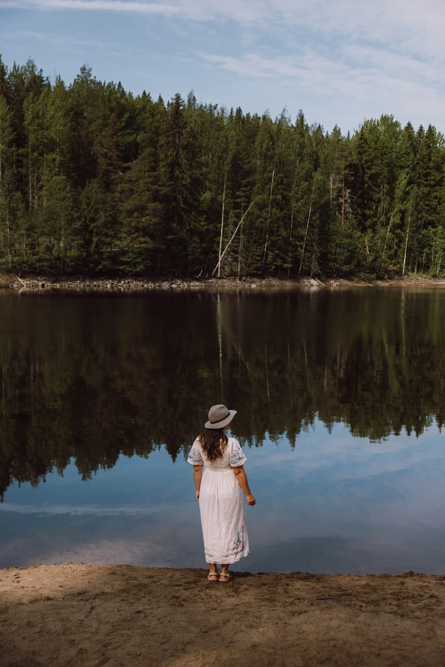 woman standing infront of lake in Laajavuori