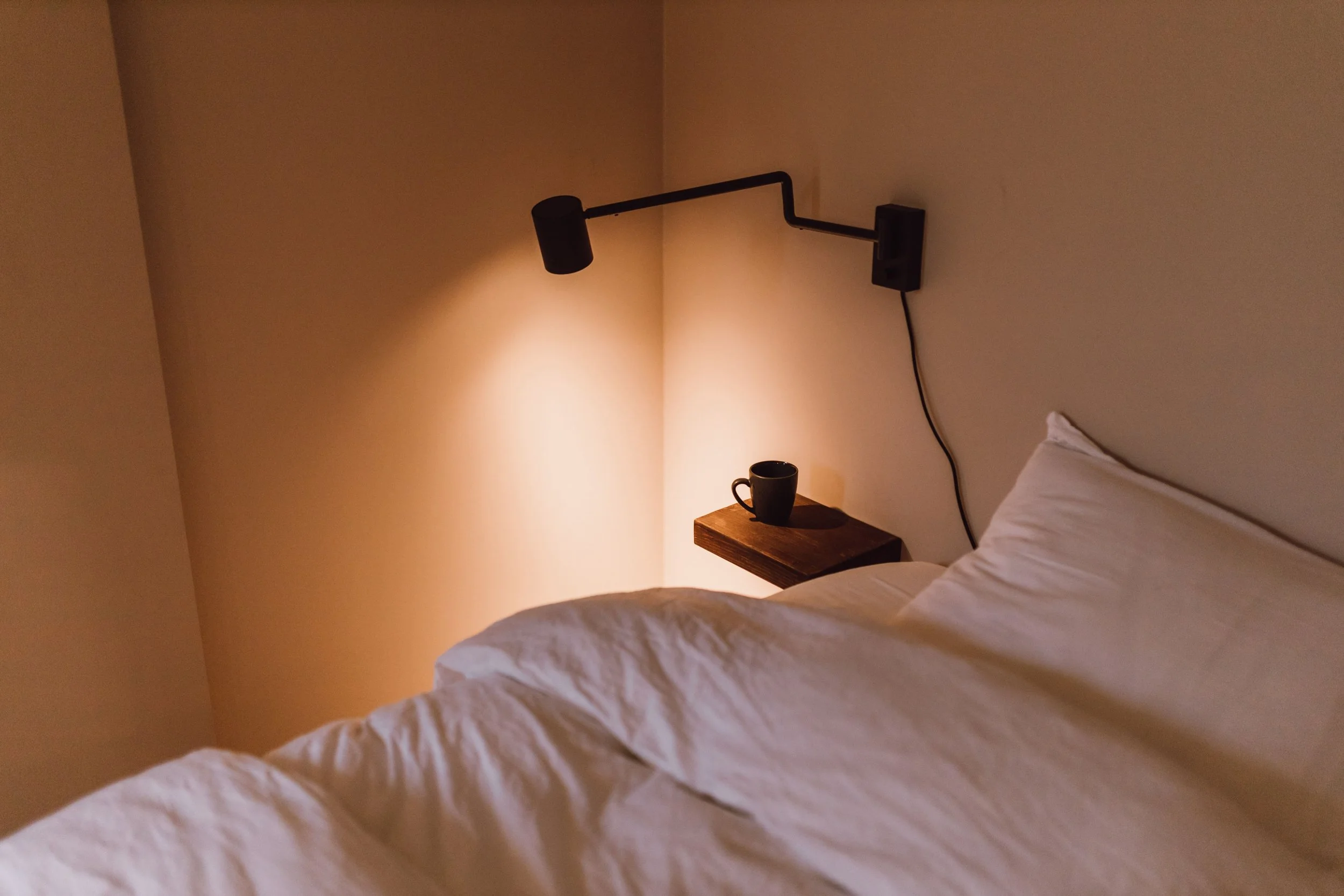 room with minimal features and light on at Brim B&B in Vagur suduroy