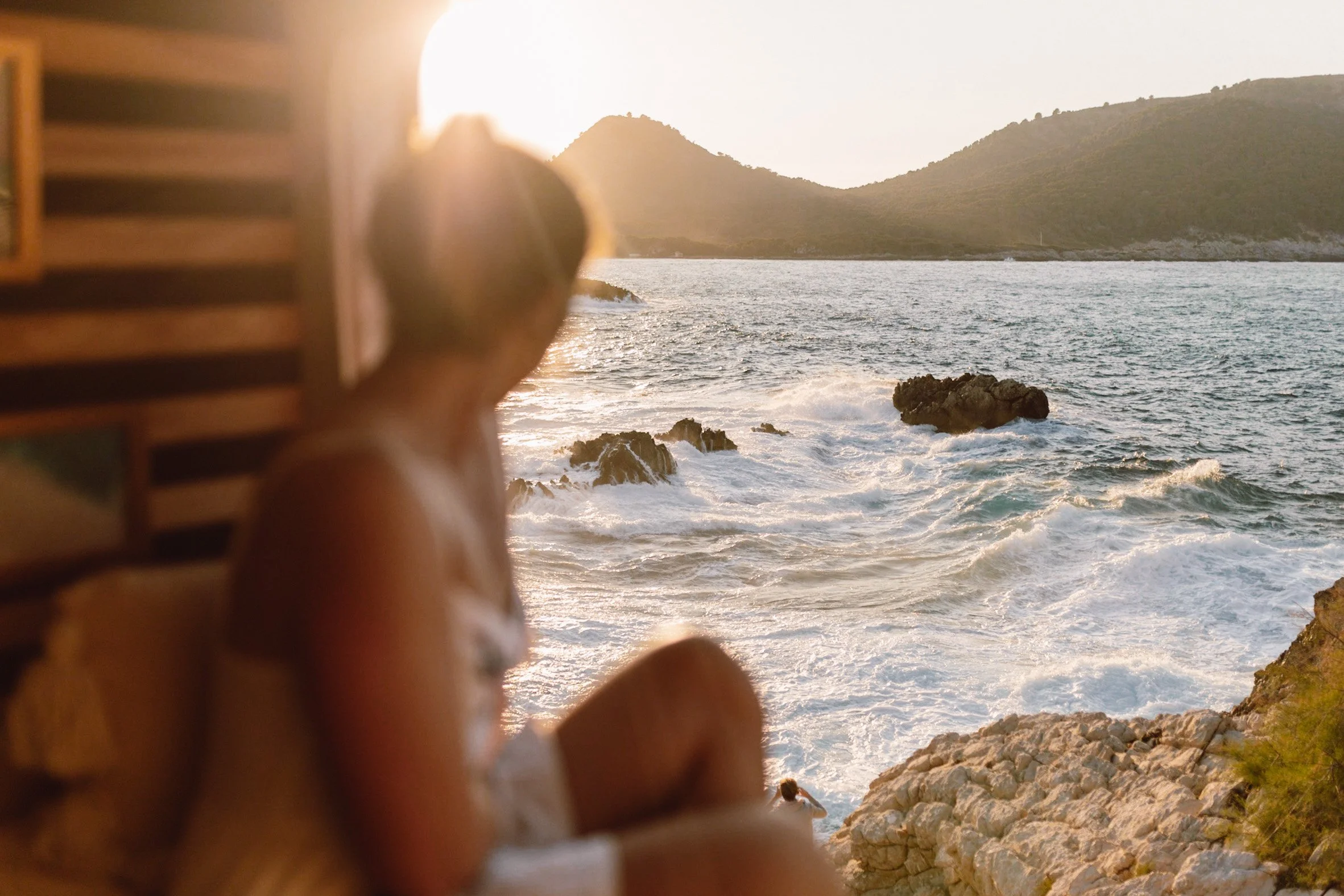 campervan motorhome mallorca road trip intinerary sunset waves crashing against rocks