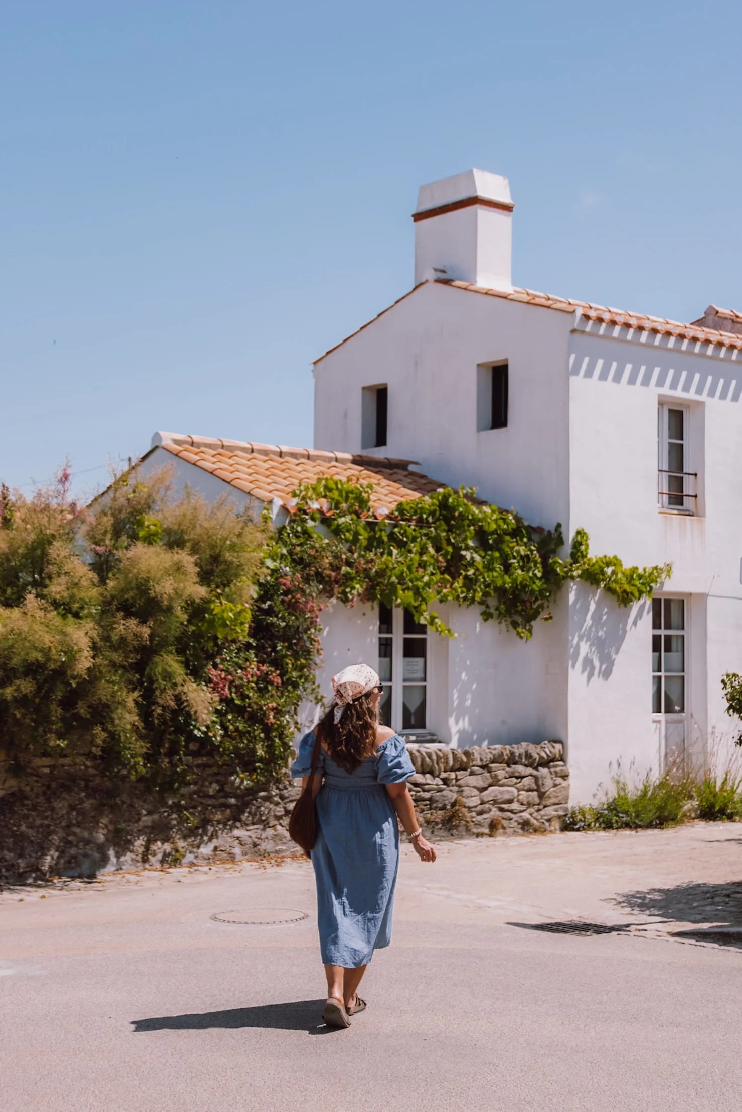 woman walking in pretty village on Noirmoutier