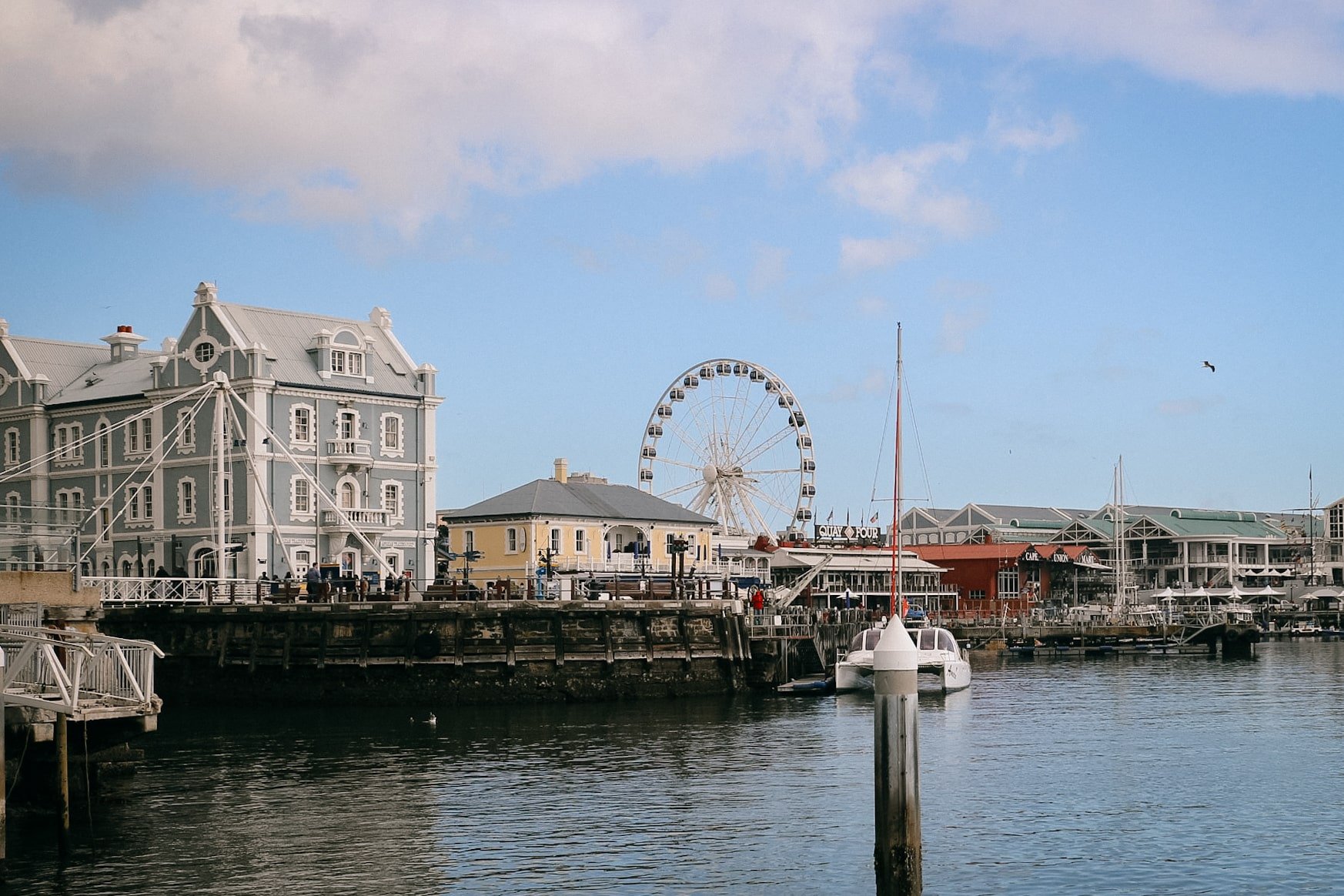 V&A Waterfront harbour with ferris wheel and cape dutch buildings