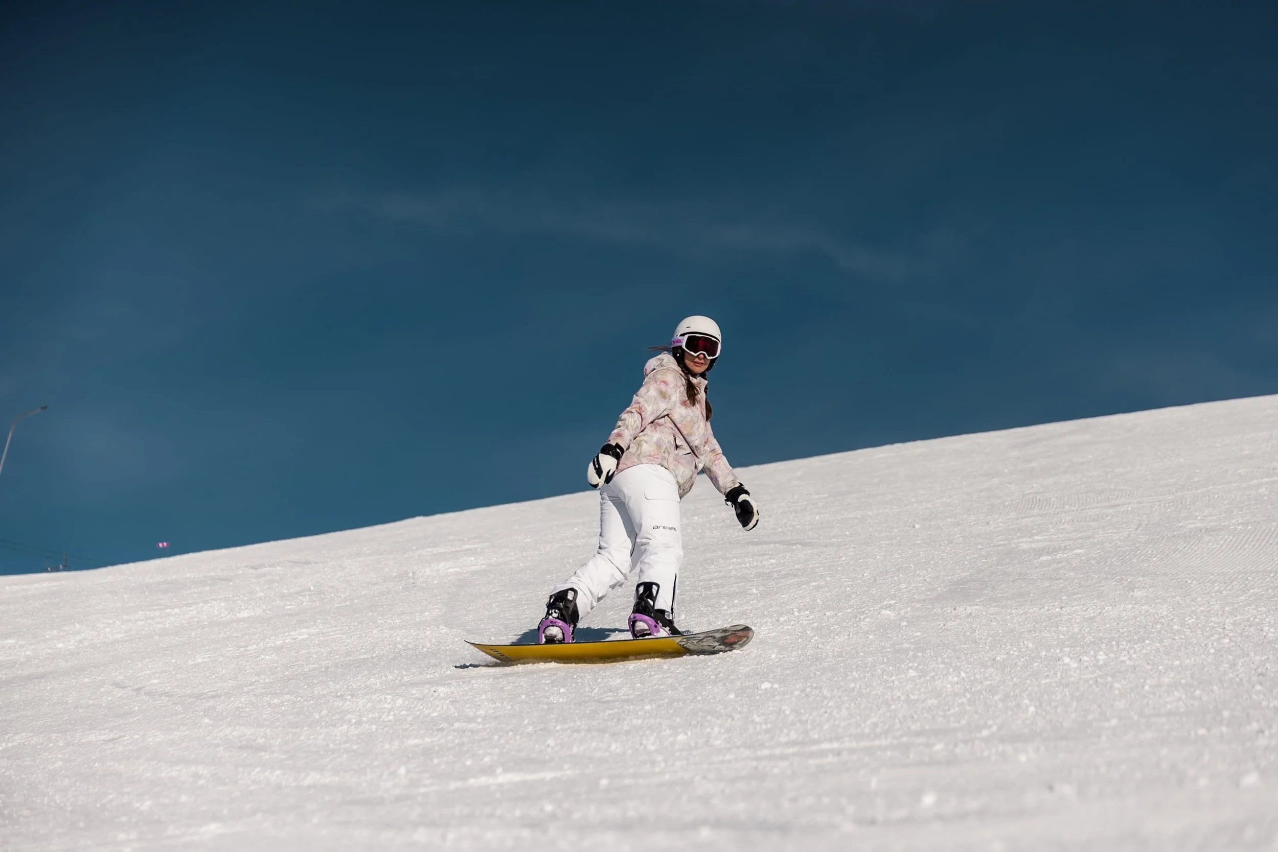 blue skies snowboarder in austria