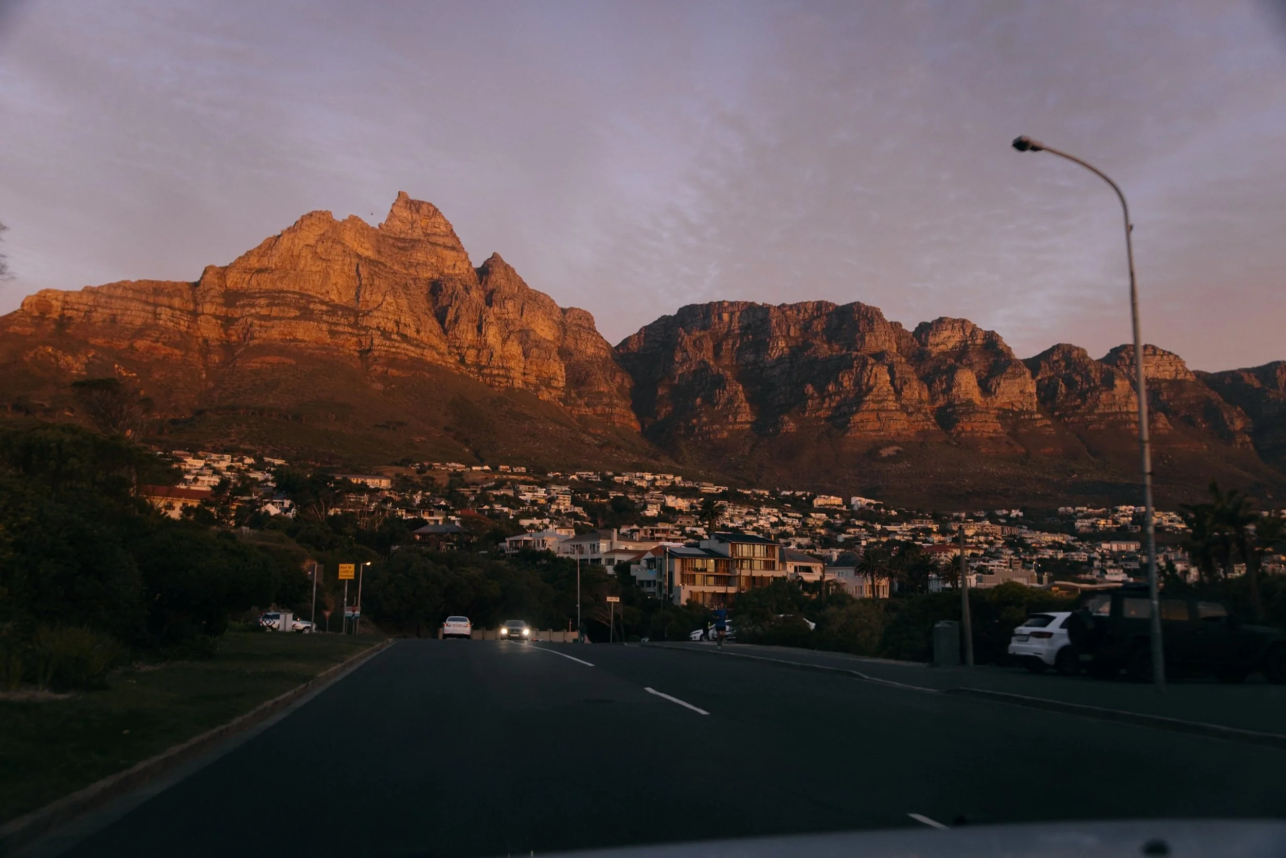 driving a car in Cape Town with mountain scenery