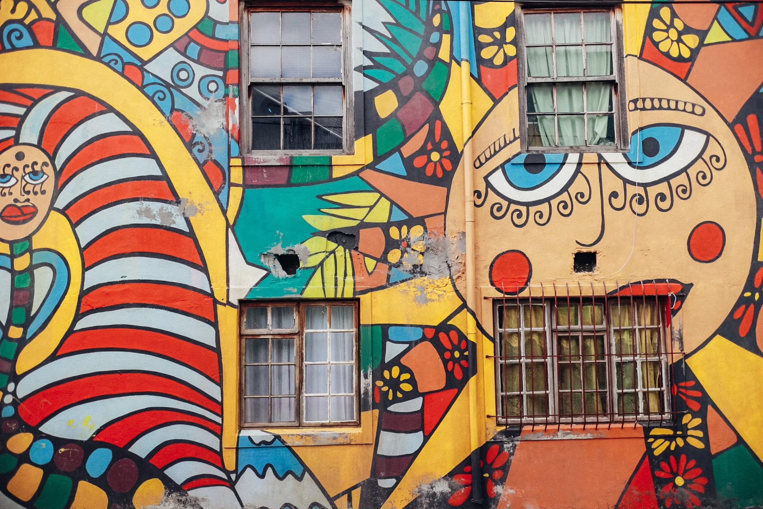 colourful street art at Bo-Kaap with a sun face illustration
