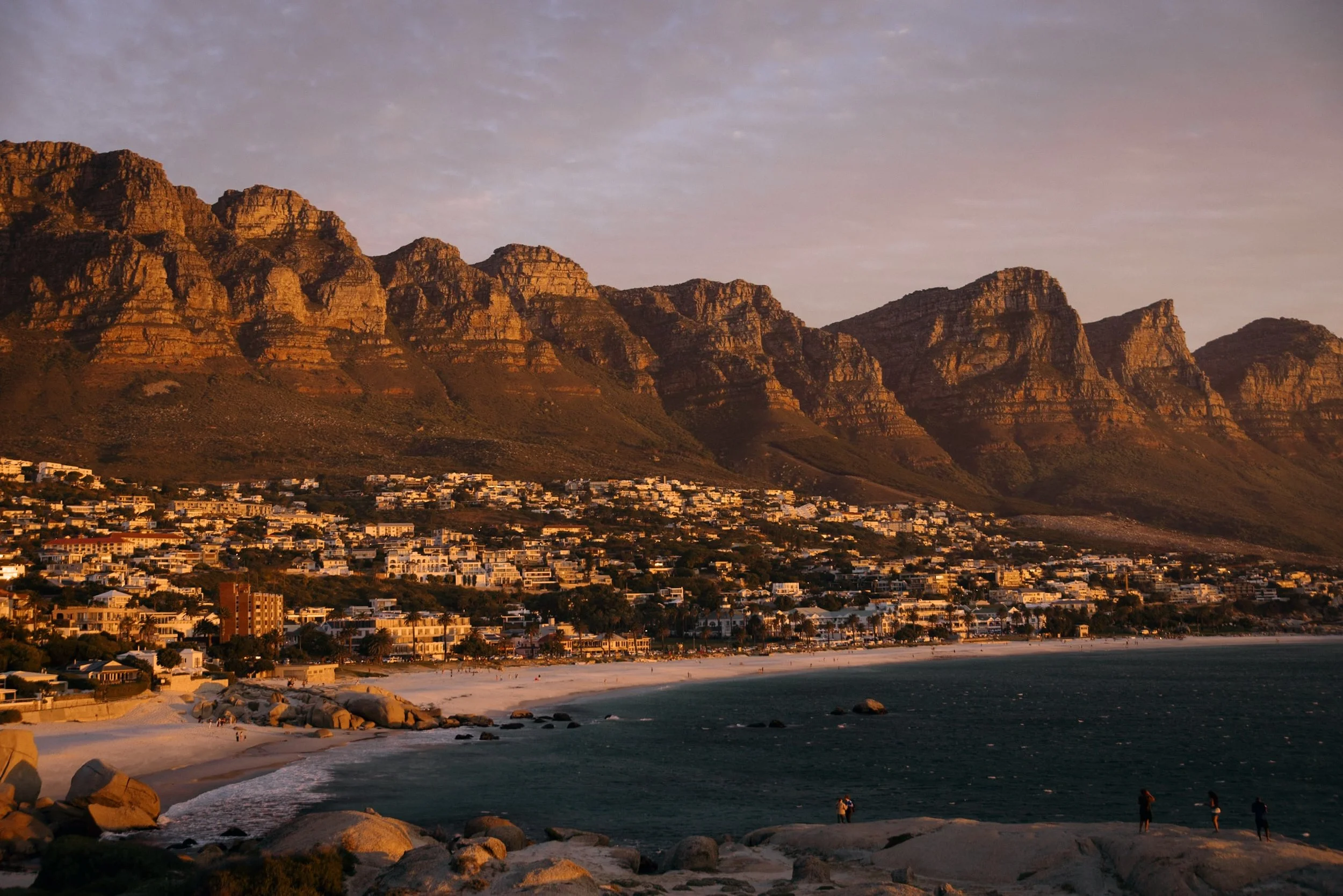 camps bay at sunset with twelve apostle peaks