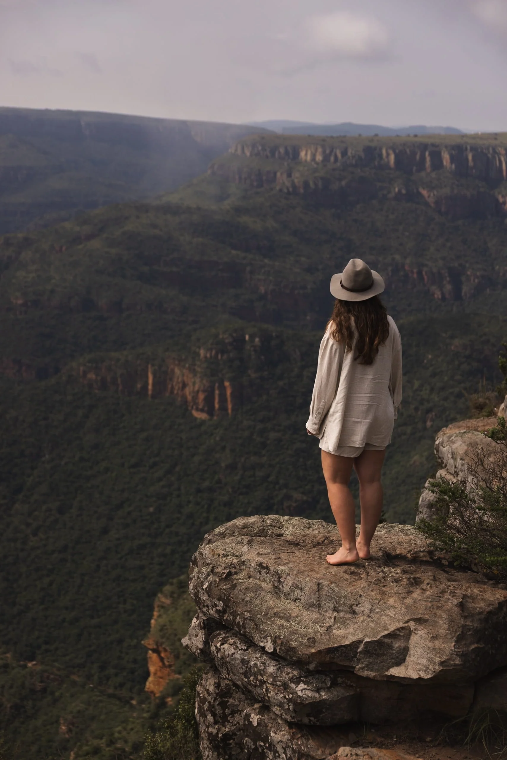 Three Rondavels viewpoint woman standing on rock in South Africa