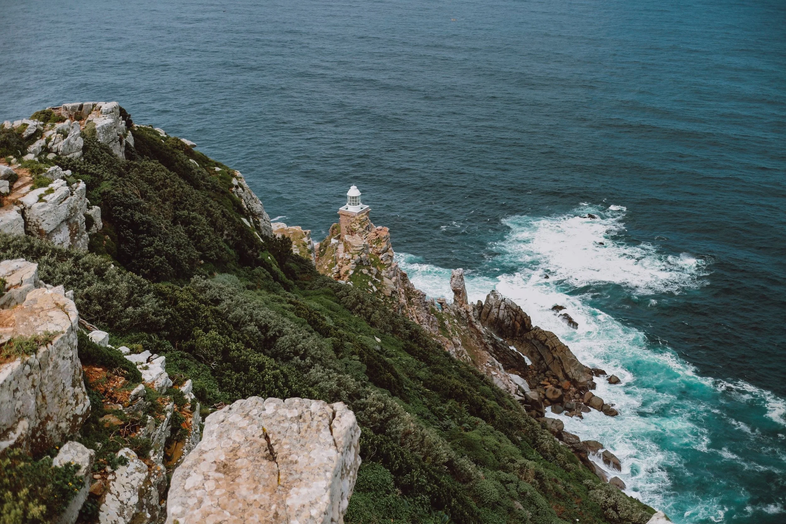 lighthouse at Cape Point with craggy cliffs
