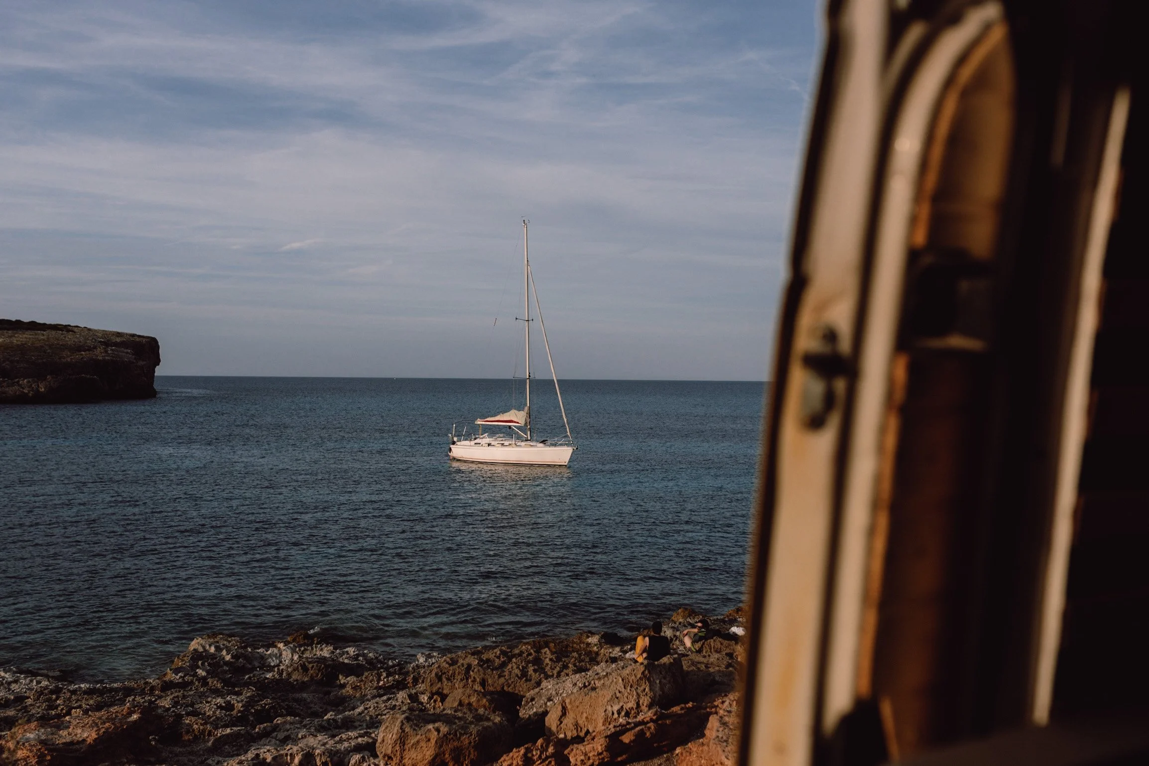 campervan motorhome mallorca road trip intinerary  view of sailing boat on ocean