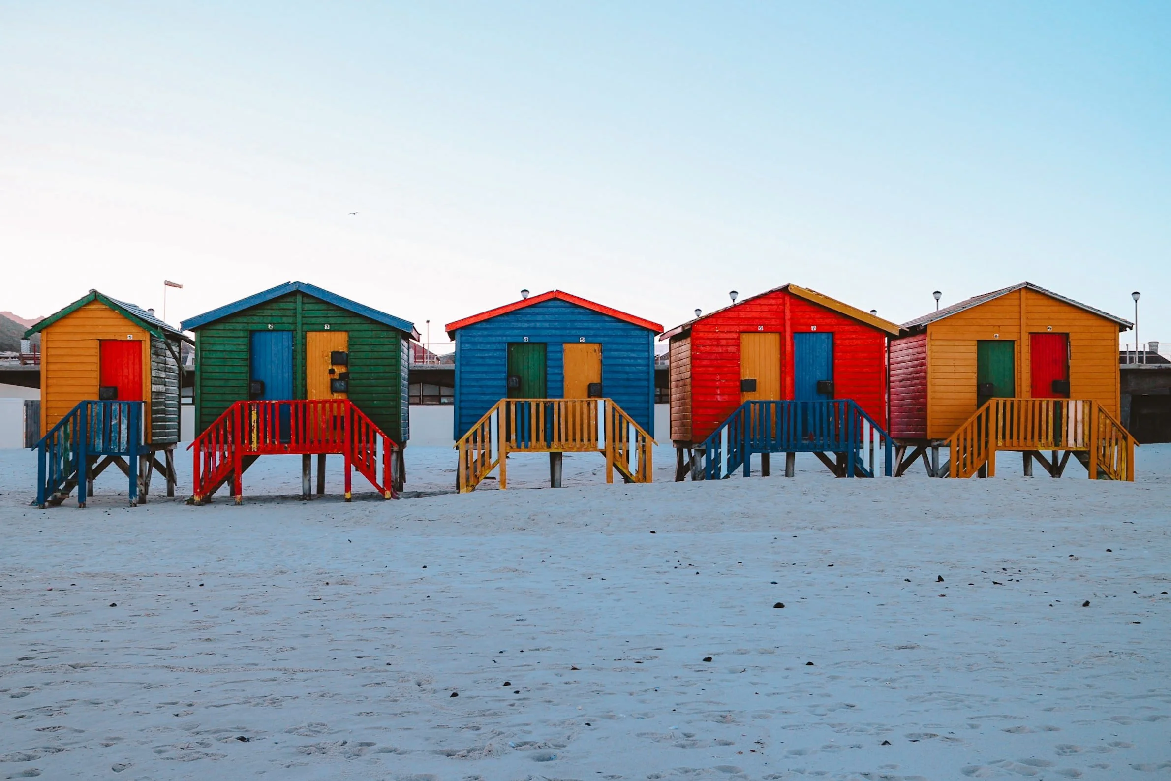 vibrant colourful beach huts on the beach at Muizenberg