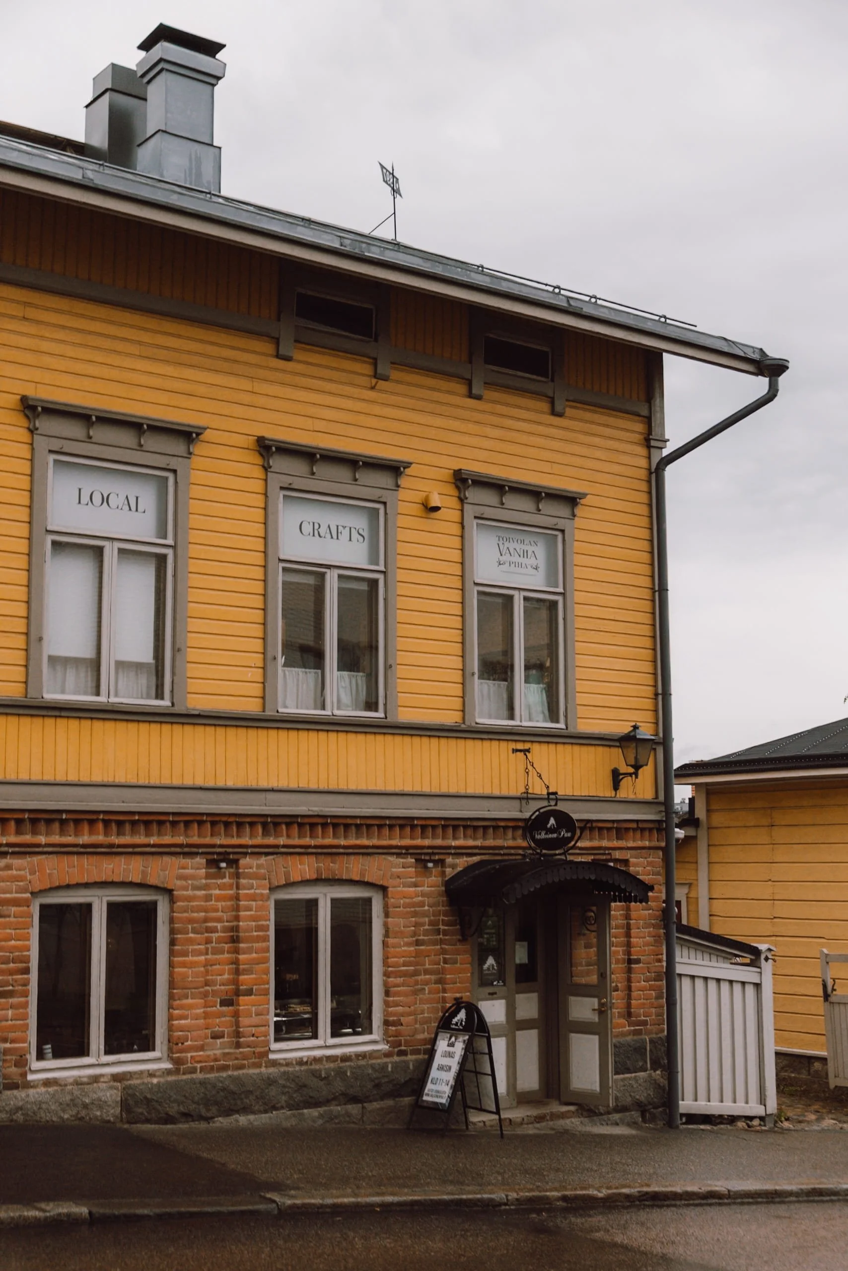 yellow cladded cafe in old town of Jyväskylä city