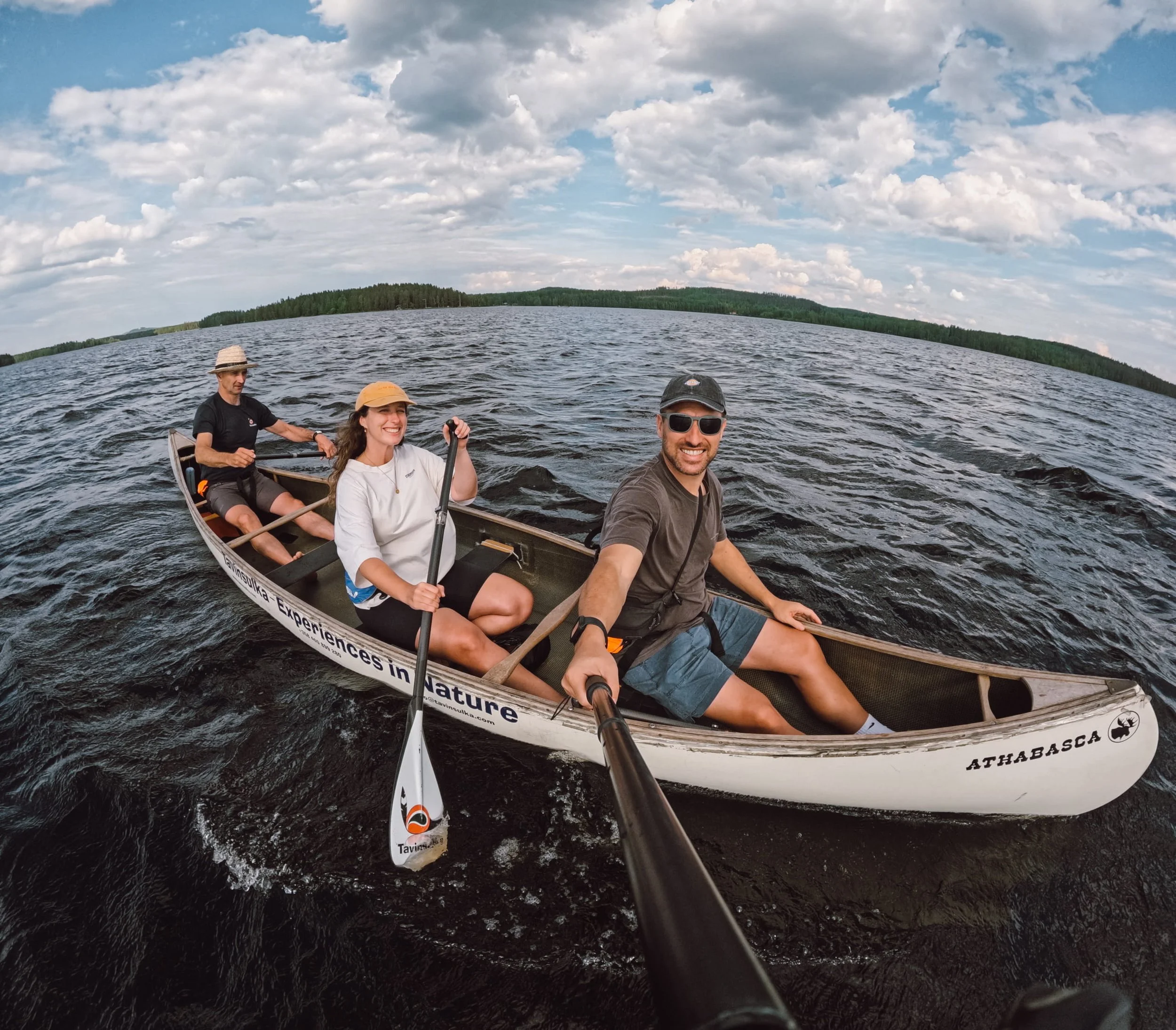 group canoeing on the lake