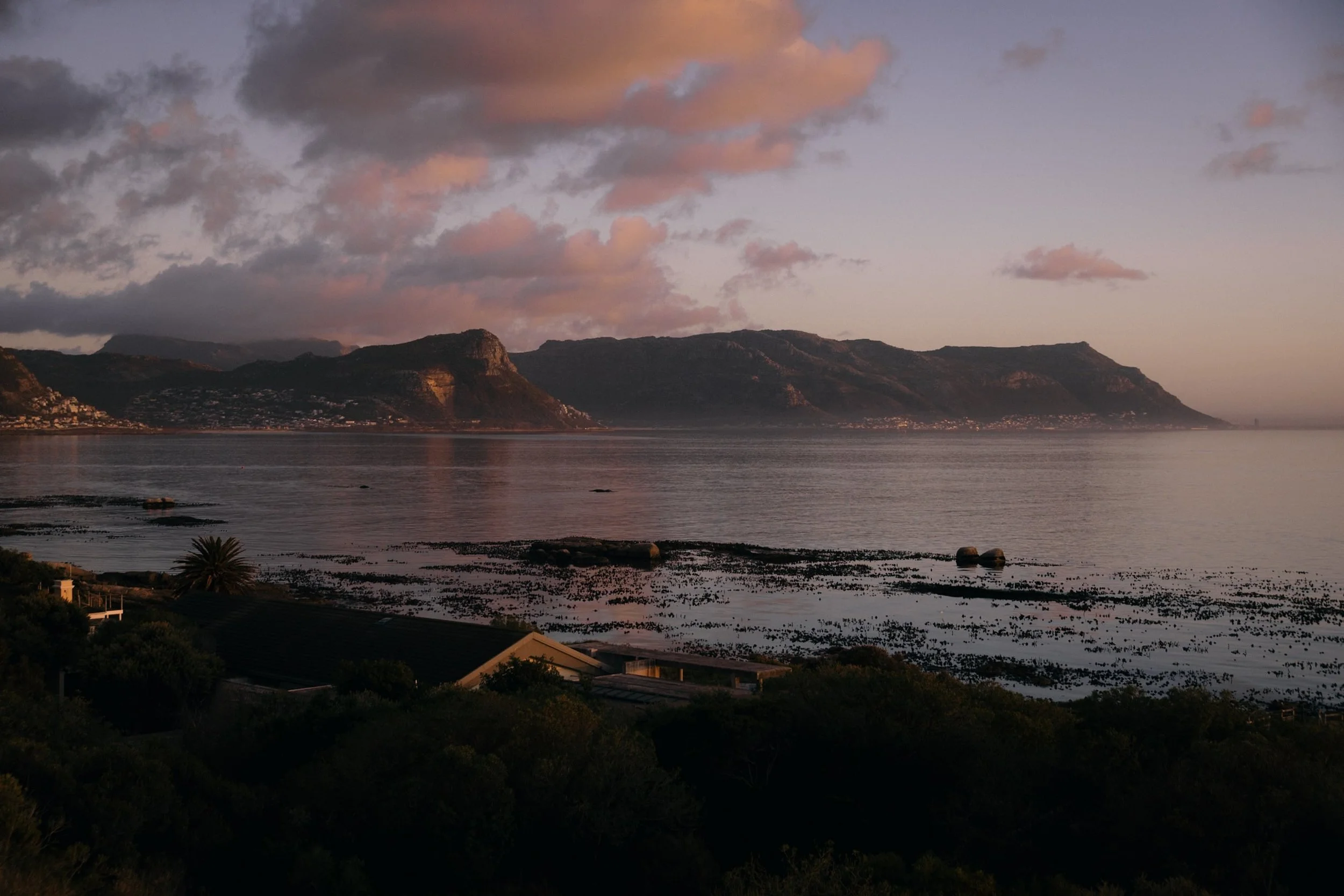 sunrise at simons town with calm ocean water