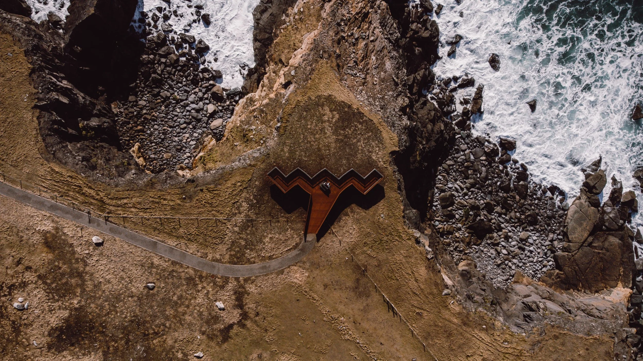 Blasket Heritage Centre aerial photo of the coast with Wild Atlantic Way sign