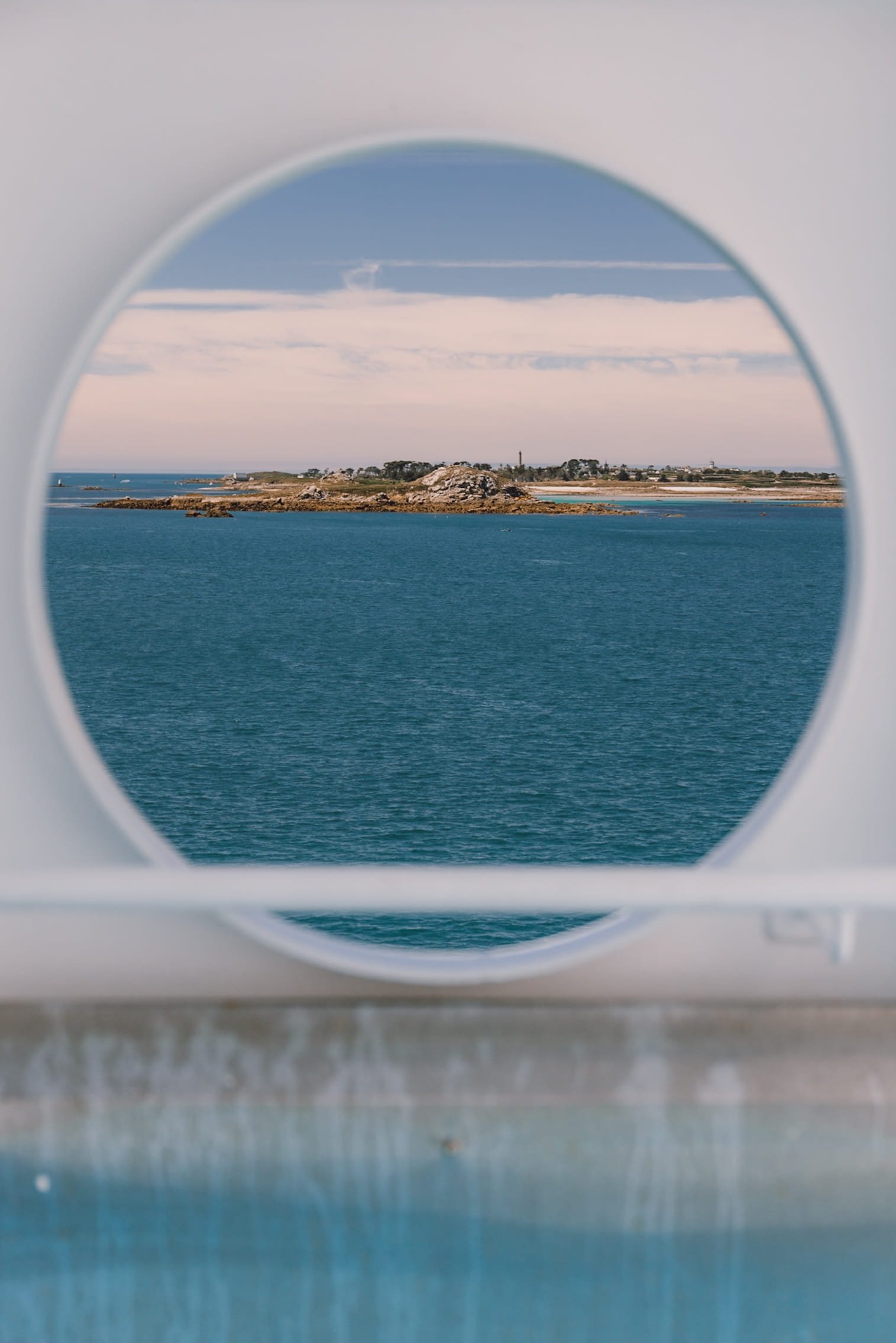 Ferry porthole with view of Île de Batz