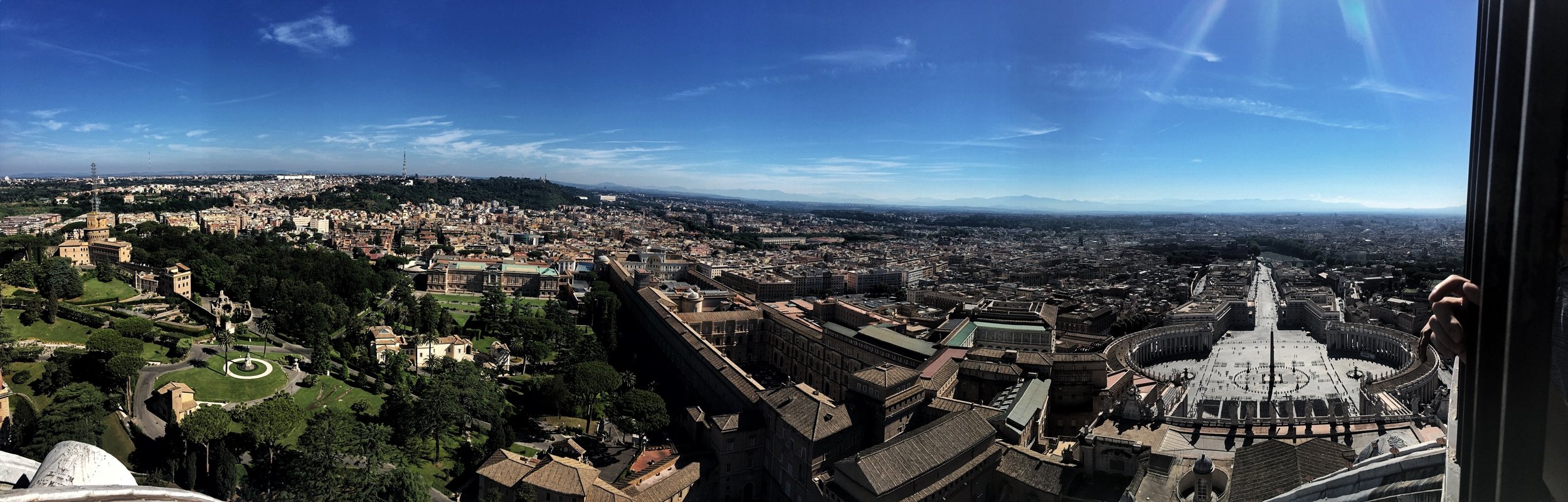 A panorama shot taken by Naomi – Vatican museum in the center, the square on the right.