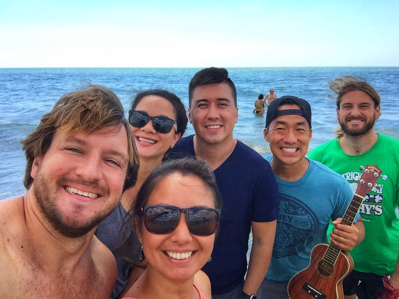 Group shot with the sea. You can see Italian monk seals in the back. 