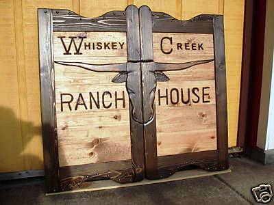 Whiskey Creek Ranch House western saloon doors with Texas longhorn