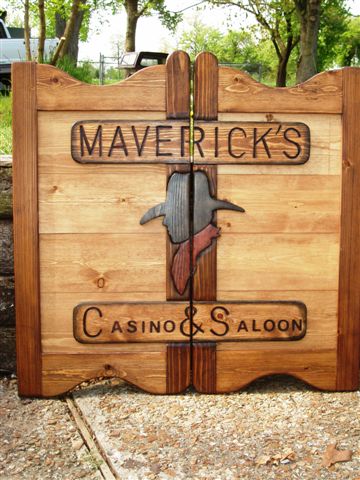 Maverick's Casino & Saloon western saloon door with cowboy and two-tone stain