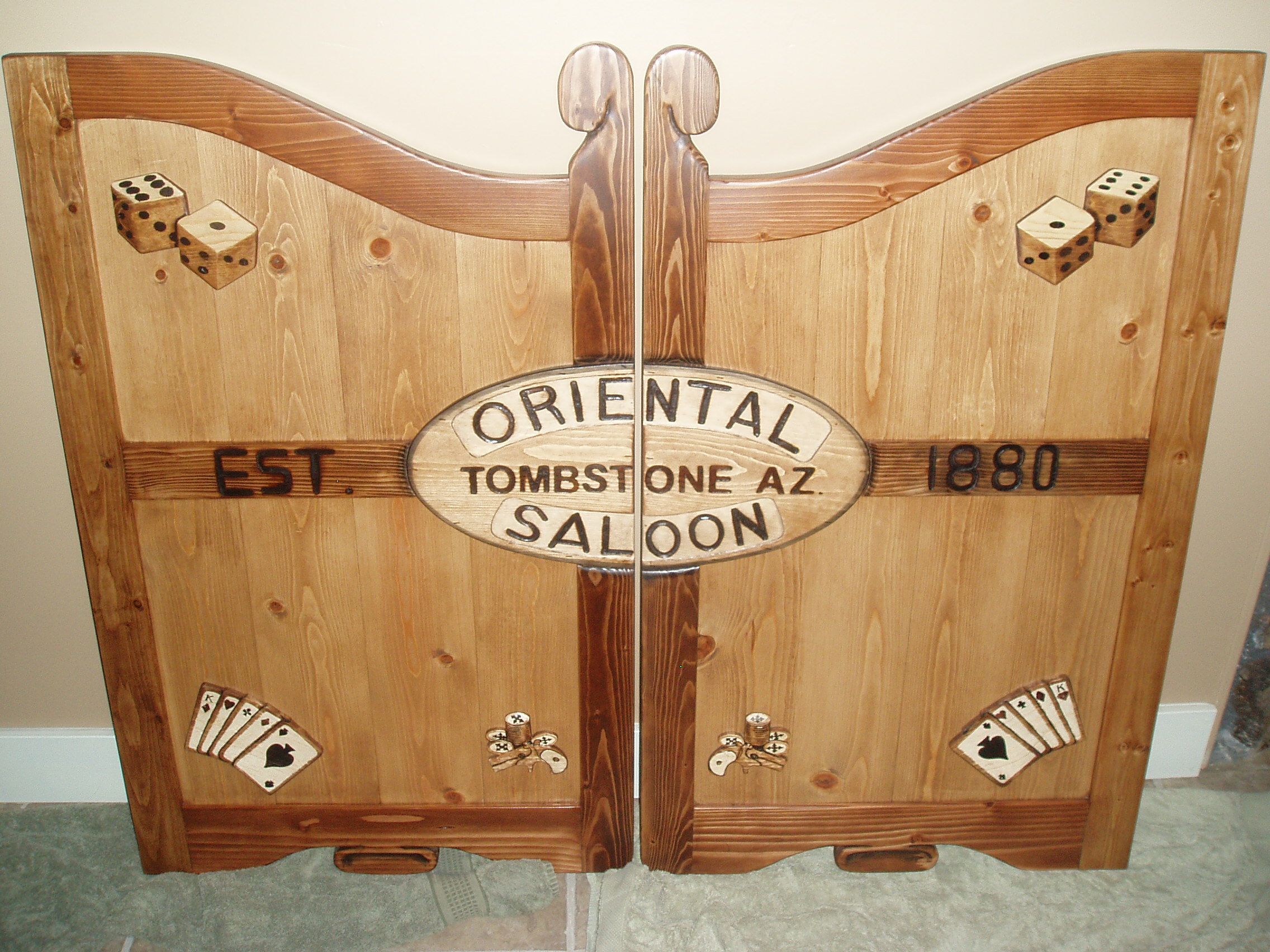 Oriental Saloon Tombstone, AZ western saloon door with dice and cards
