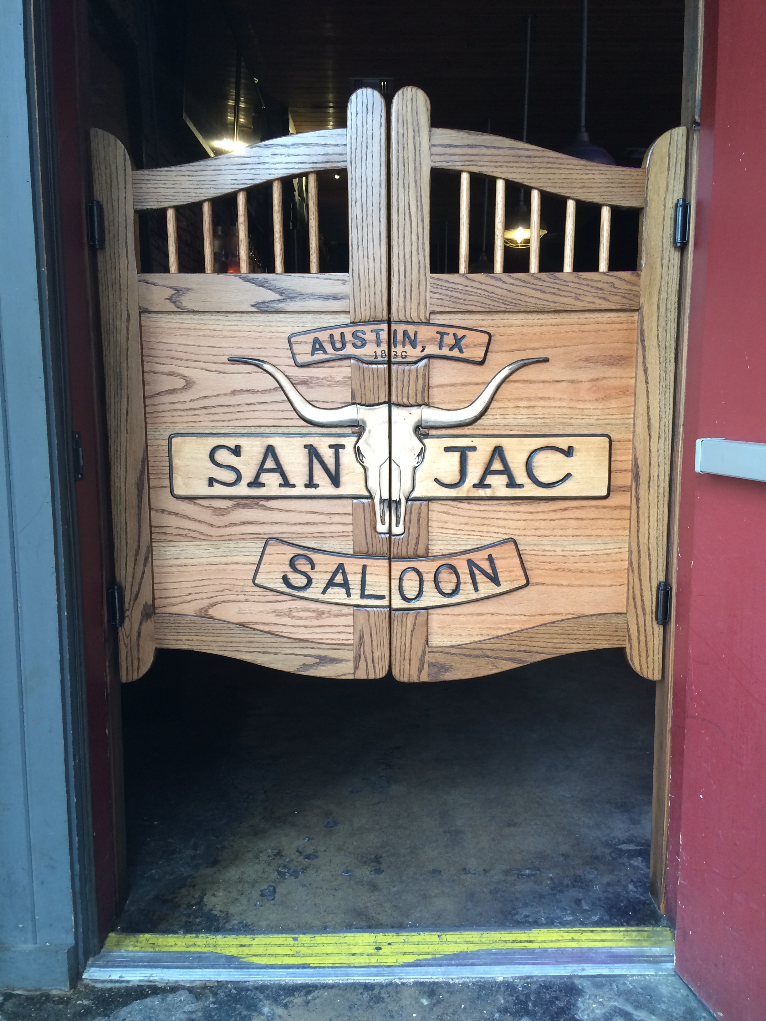 Western swinging saloon door with longhorn skull - San Jac Saloon, Austin, TX