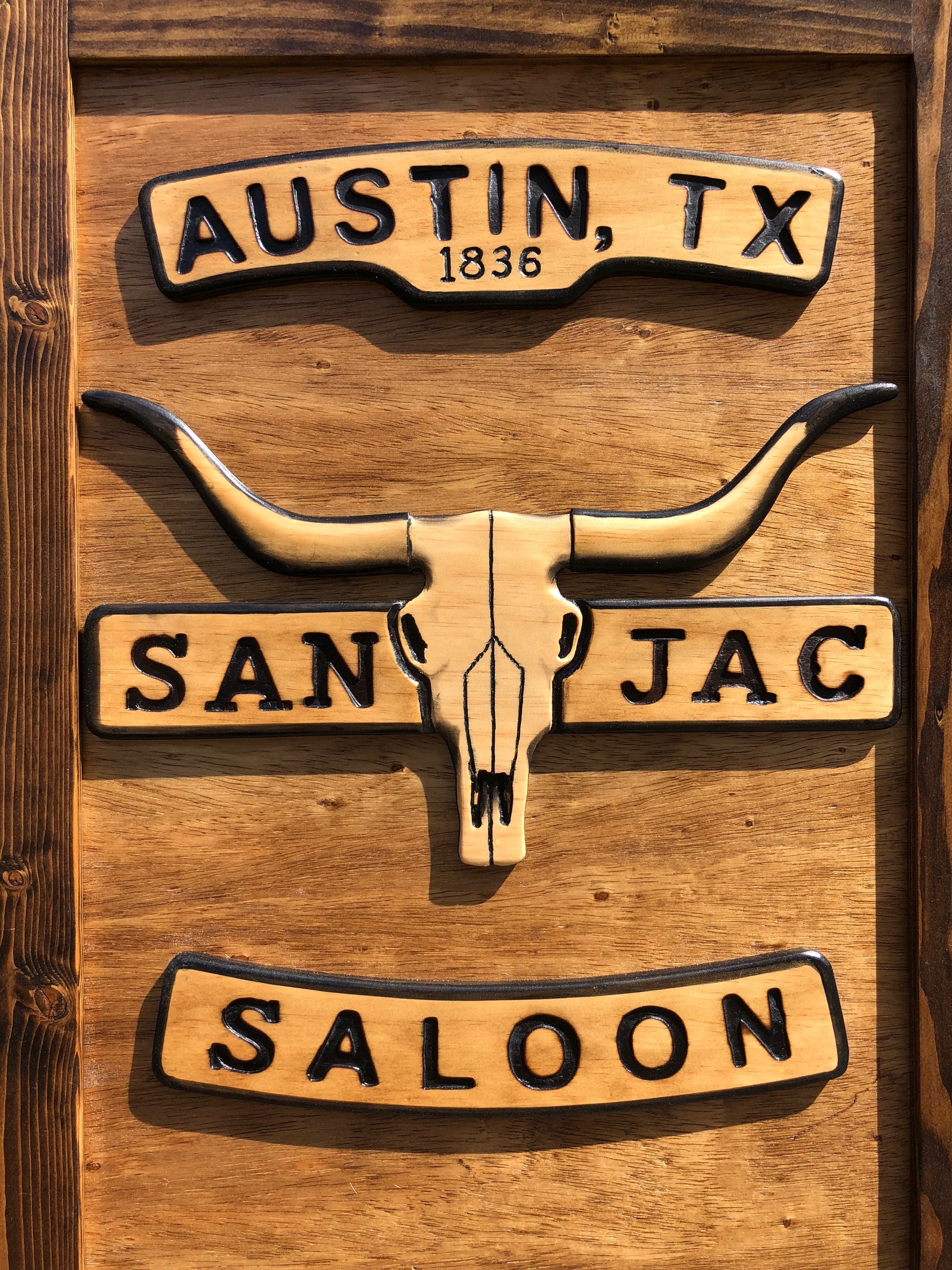 Western swinging saloon door with longhorn skull close up - San Jac Saloon, Austin, TX