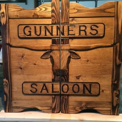 Gunners Saloon western saloon door with Texas longhorn and custom lettering