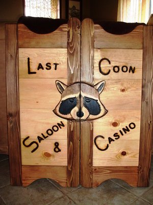 Last Coon Saloon & Casino western saloon door with raccoon