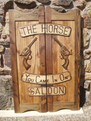 The Horse You Came In On Saloon western saloon door with six shooter pistols