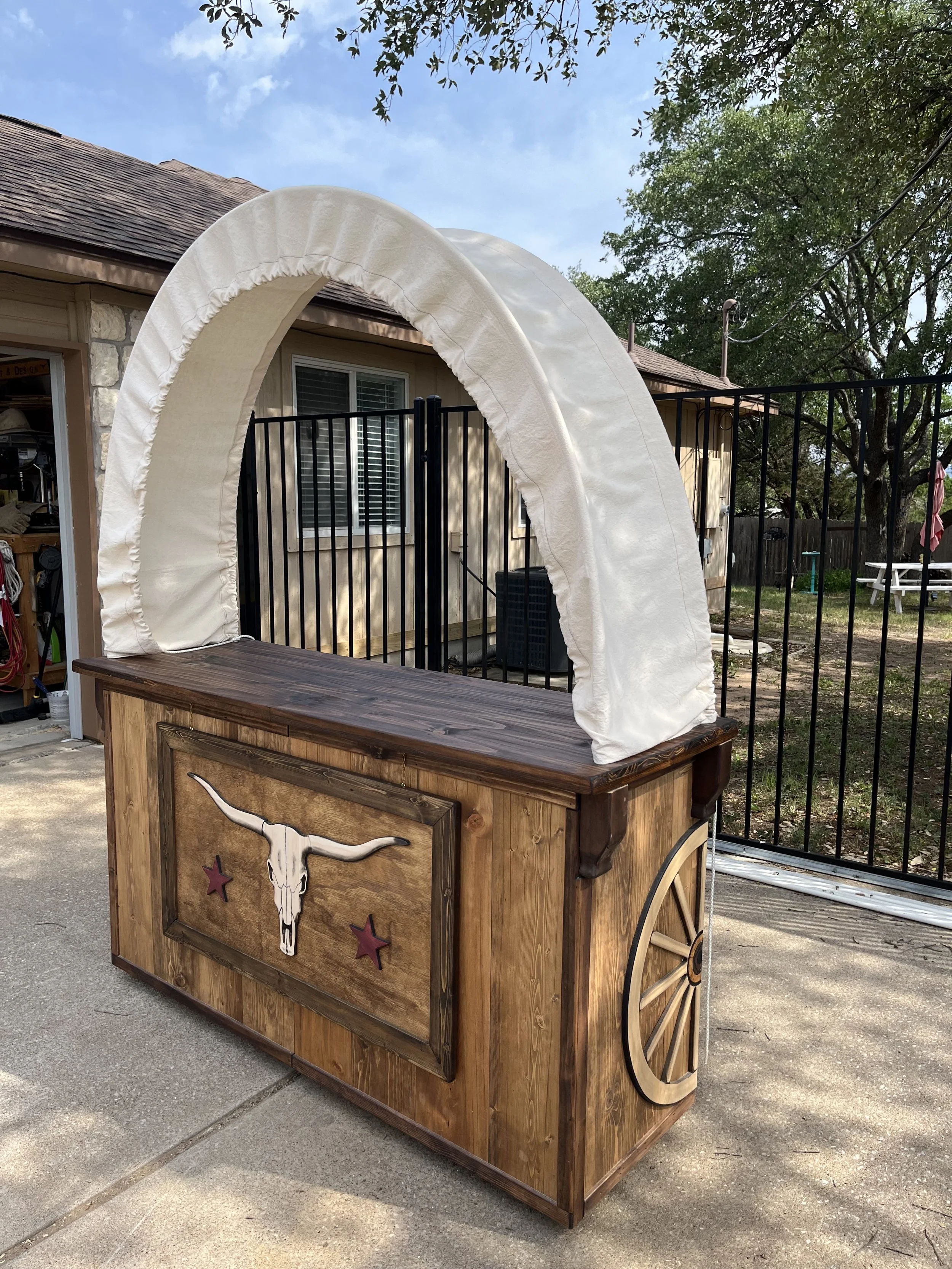 Hand carved western conestoga wagon bar
