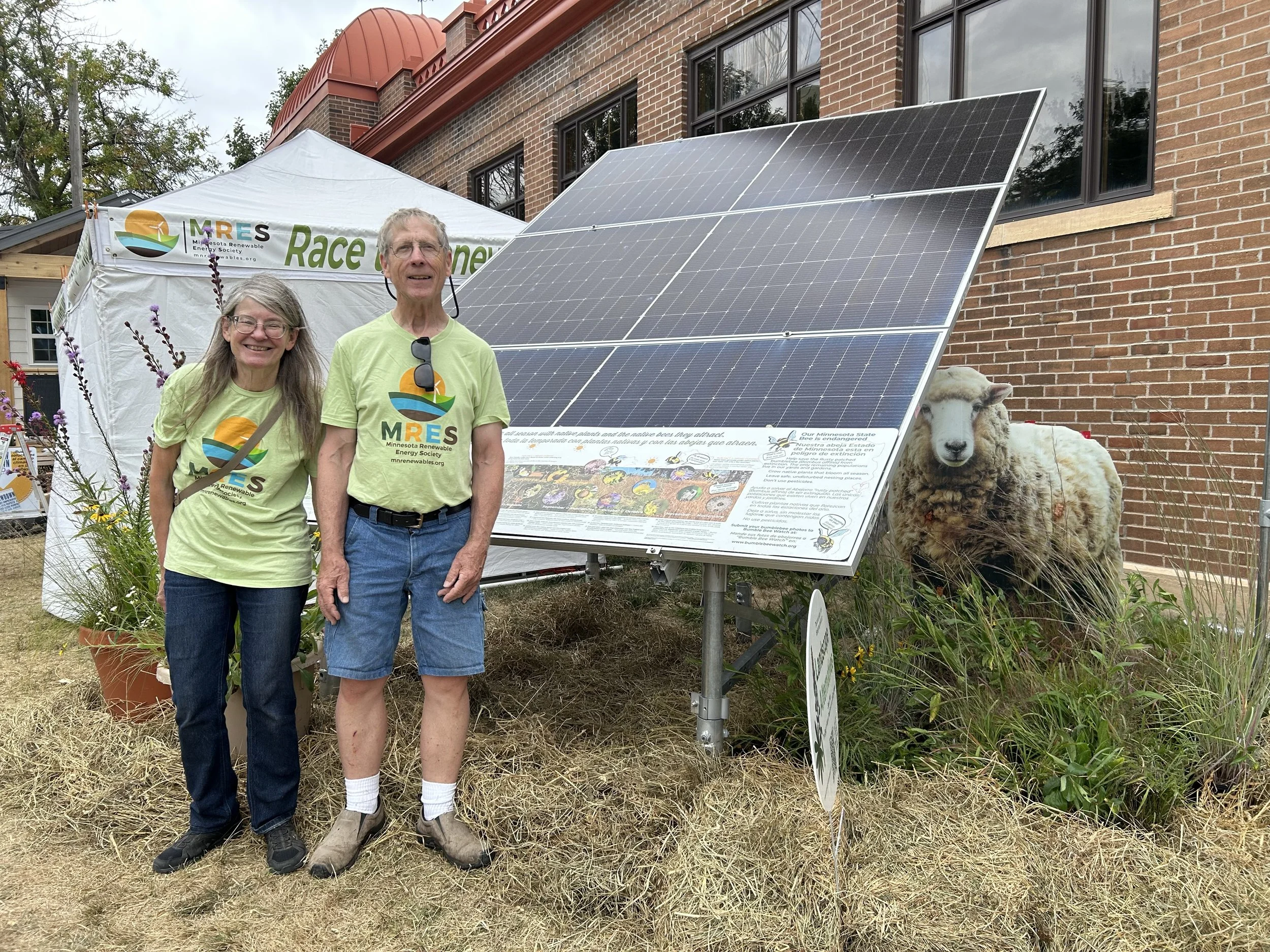 Chris & Russ with solar pollinator_IMG_7378.jpeg