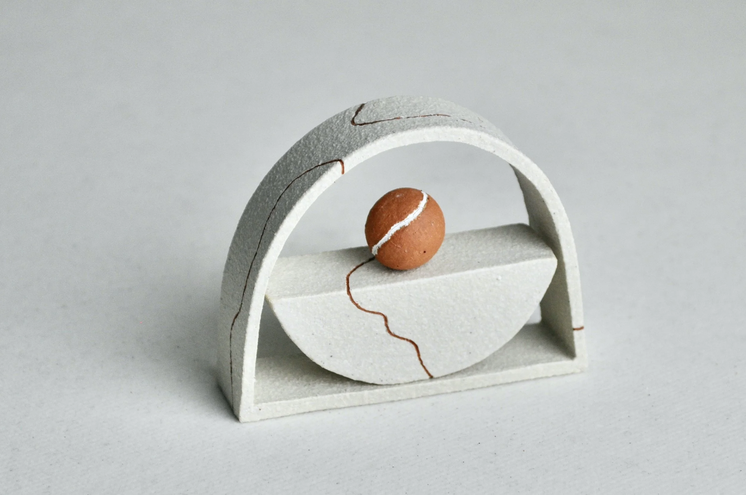   Home  2022, 6cm H x 8cm W x 2cm D, white raku clay, BRT &amp; found clay slip with slip inlays 